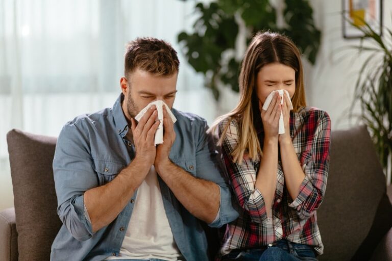 Couple Blowing Nose