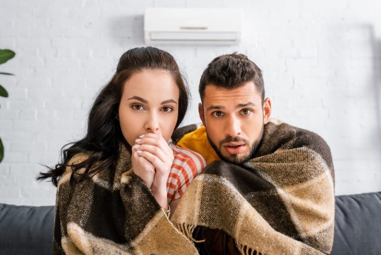 Broken Ductless Heat Causing Young Couple To Huddle In Blanket